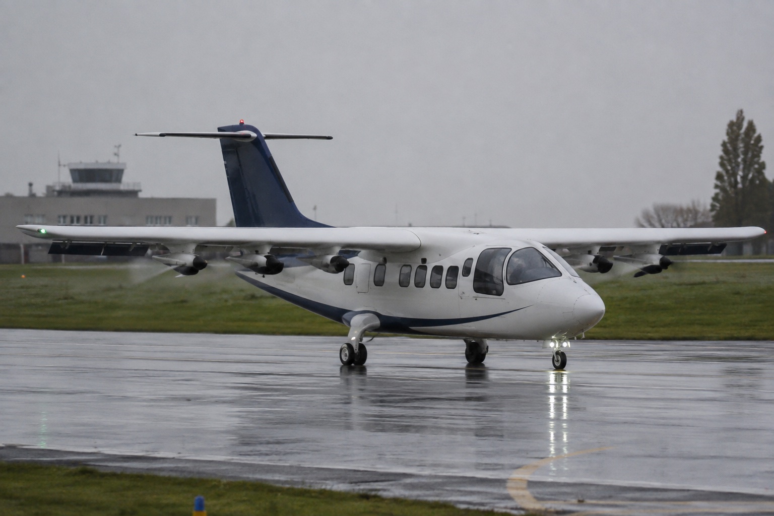 Hybrid-electric regional aircraft taxiing on a wet runway